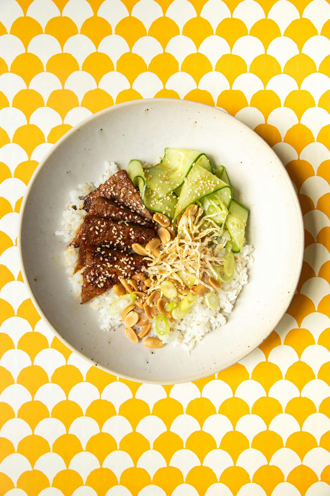 tempeh bowl on yellow patterned background