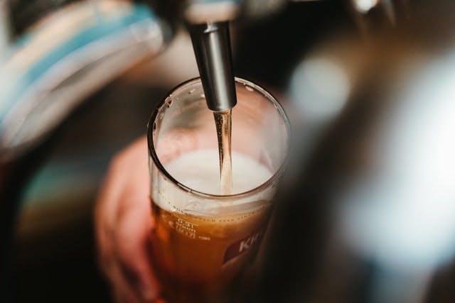 beer poured from a tap