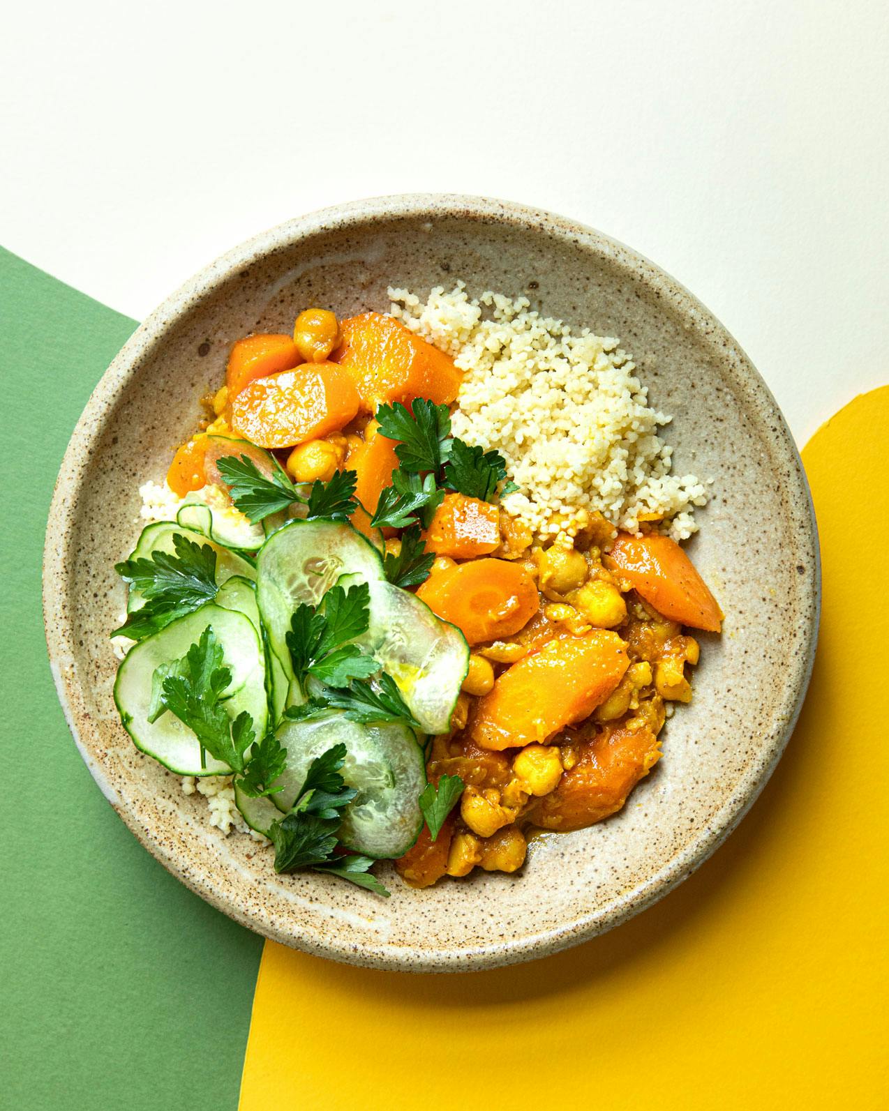 carrot chickpea tagine on white yellow and green background