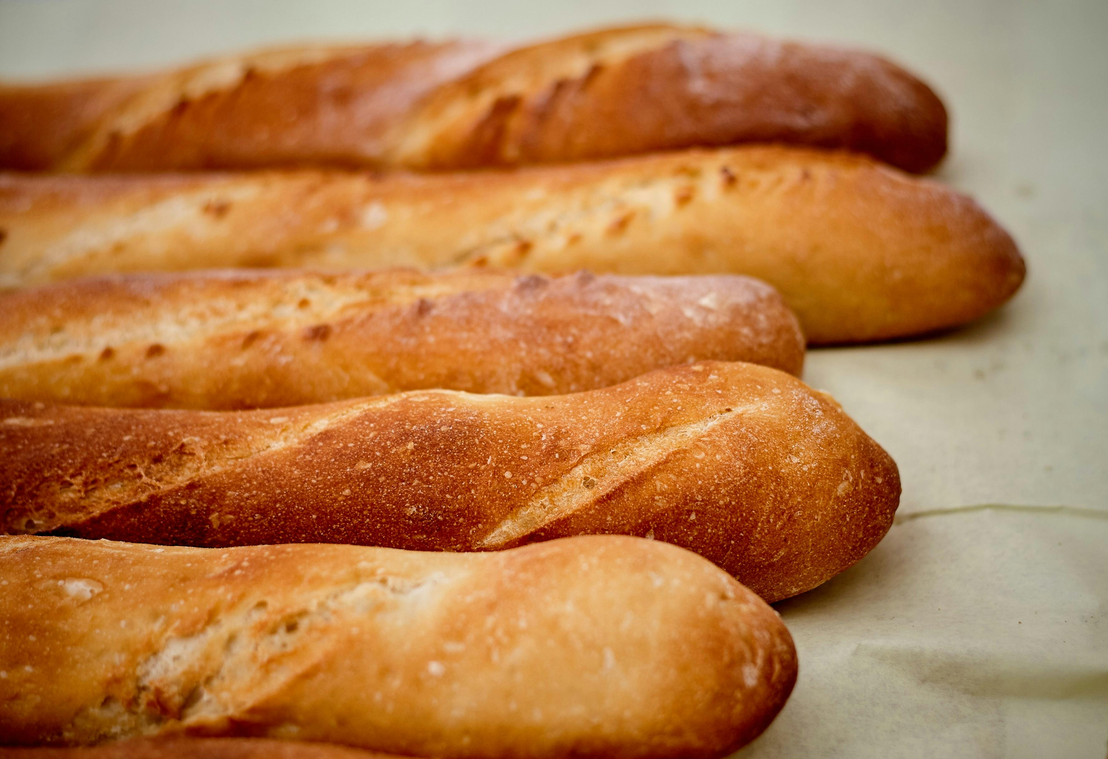 Four baguettes on a cloth