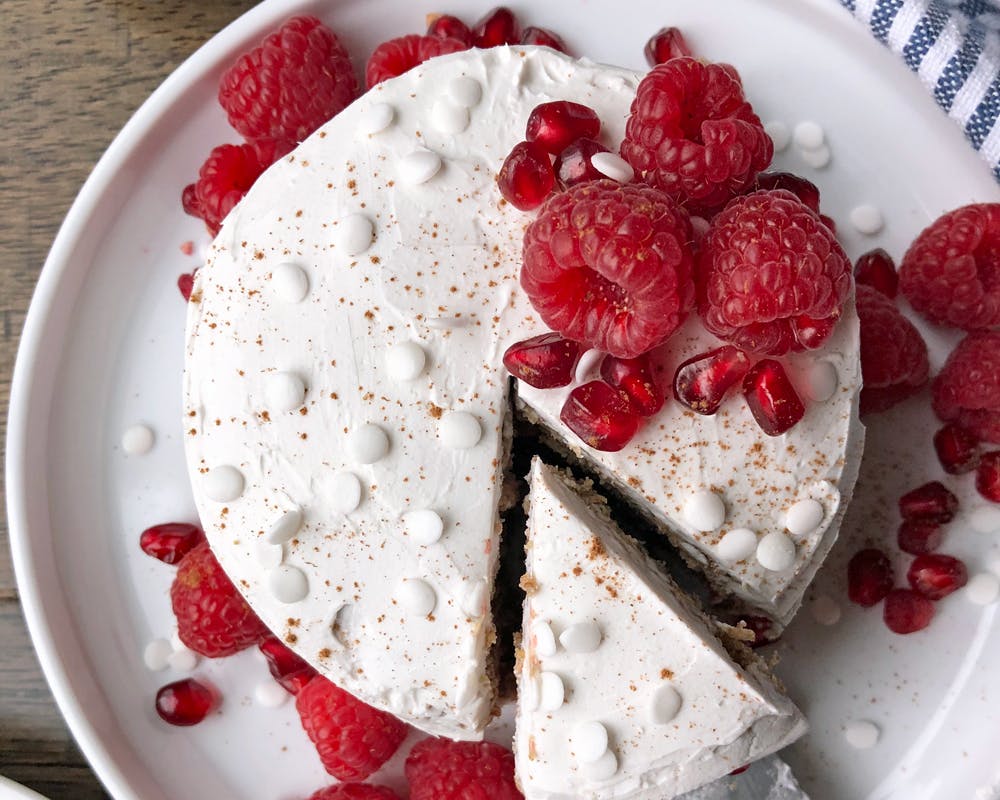 smash cake opped with raspberries