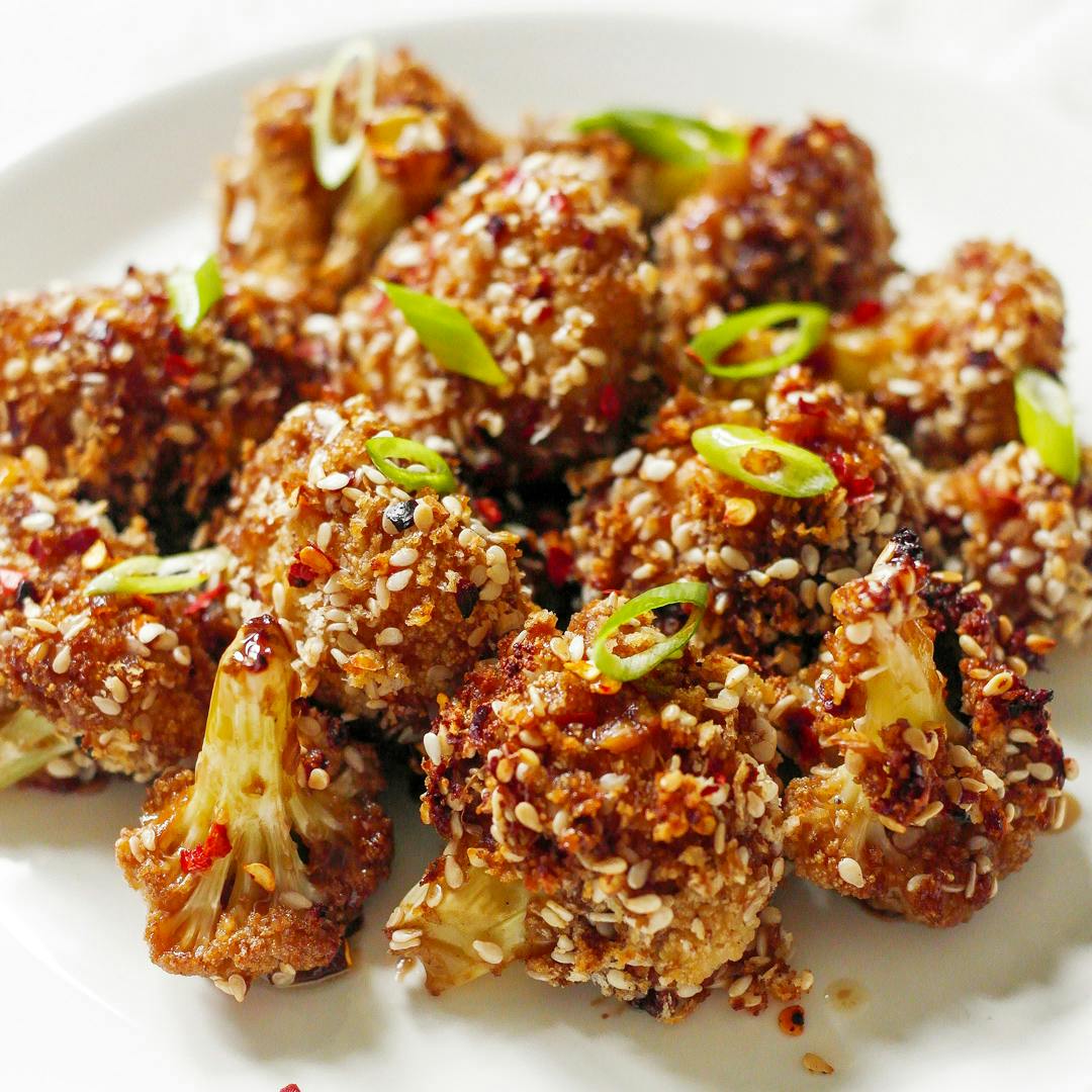 sesame teriyaki cauliflower, garnished with spring onions