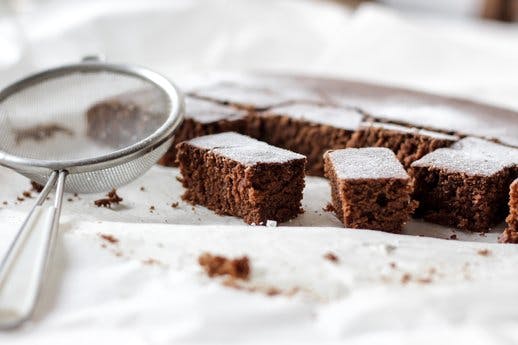 brownies dusted with sugar with sieve