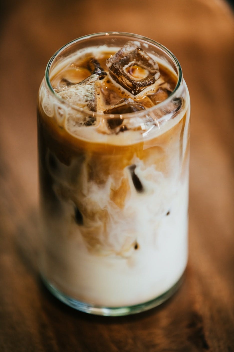 Pouring coffee in ice cube tray on grey background - Ducks 'n a Row