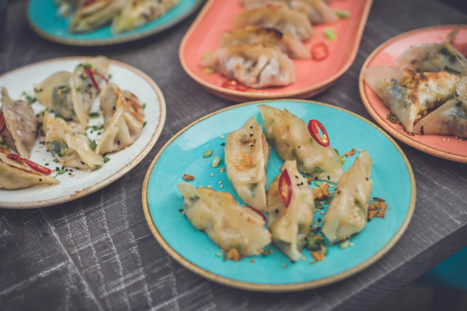 dumplings on colourful plates