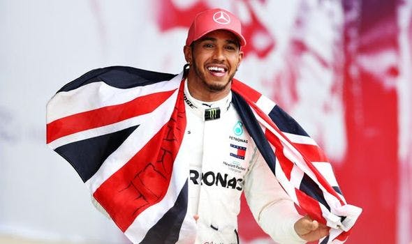 Lewis Hamilton holding British flag