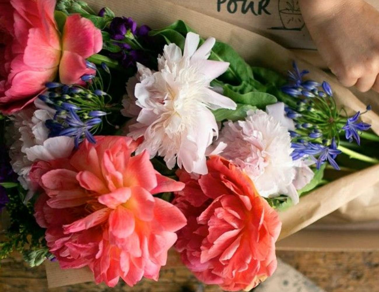 a bouquet of flowers being tied up