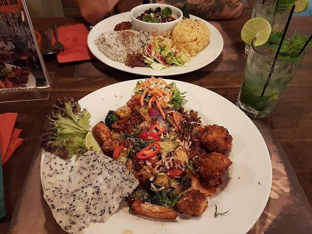 vegan chinese meals on two plates on table