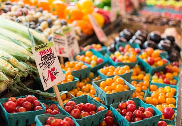 lots of tomatoes at a market