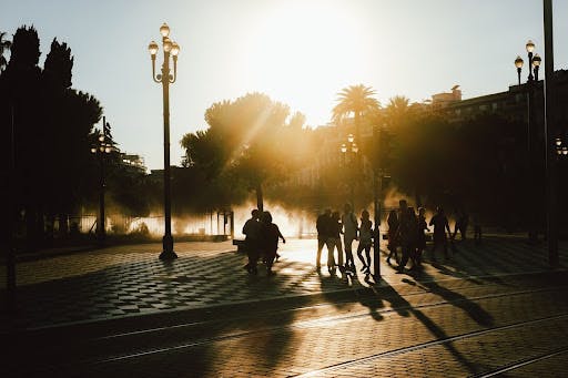 people in a sunny square