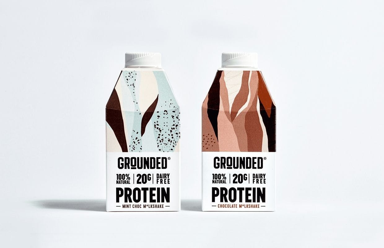 two vegan milkshake cartons on white background