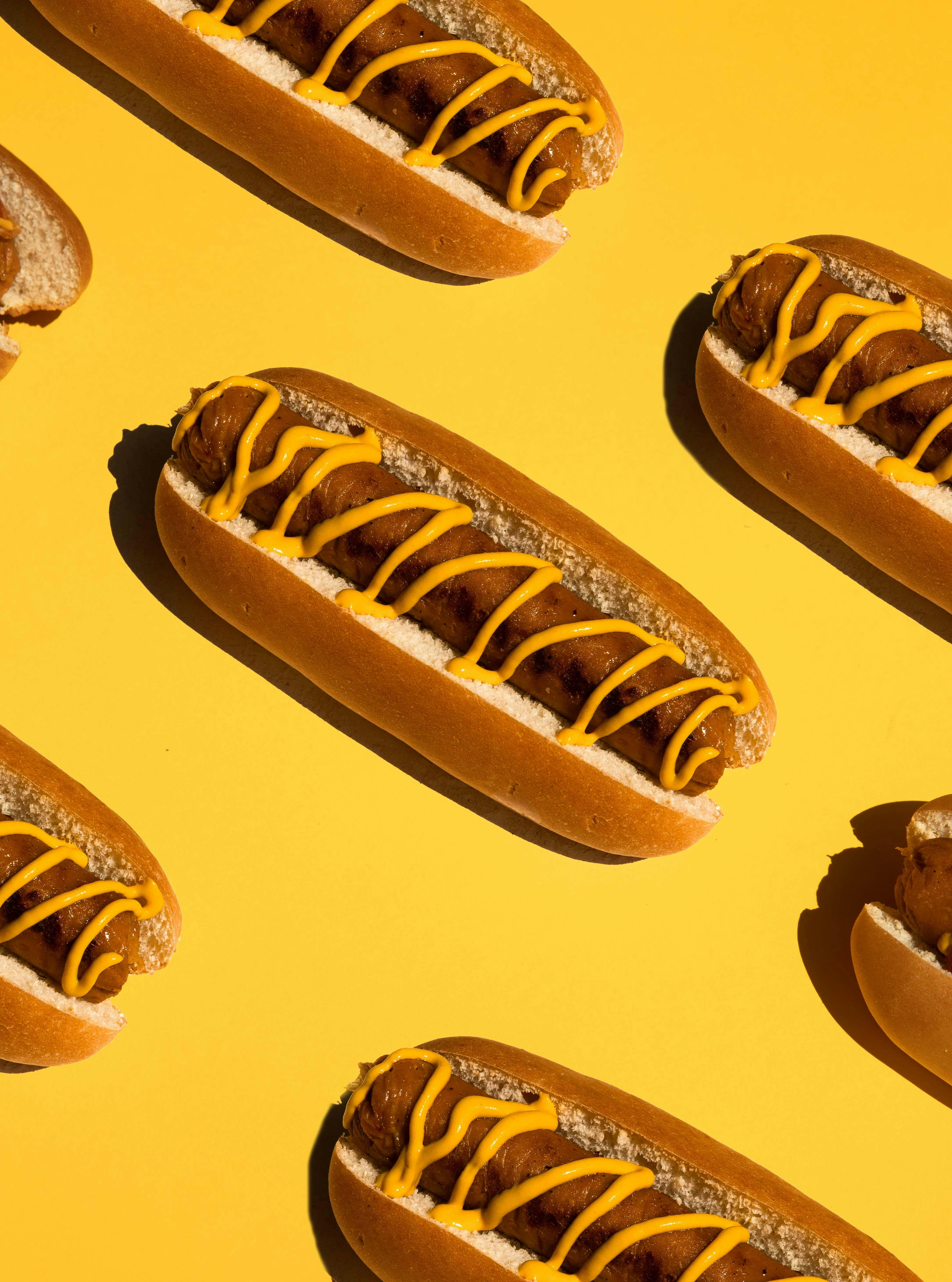 hotdogs on yellow background
