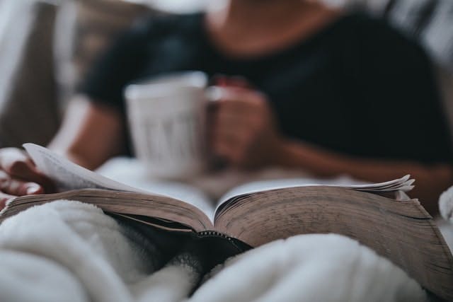 relaxed reading in bed