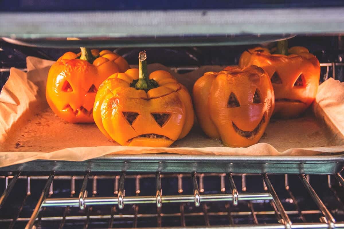 stuffed peppers that look like pumpkins with faces