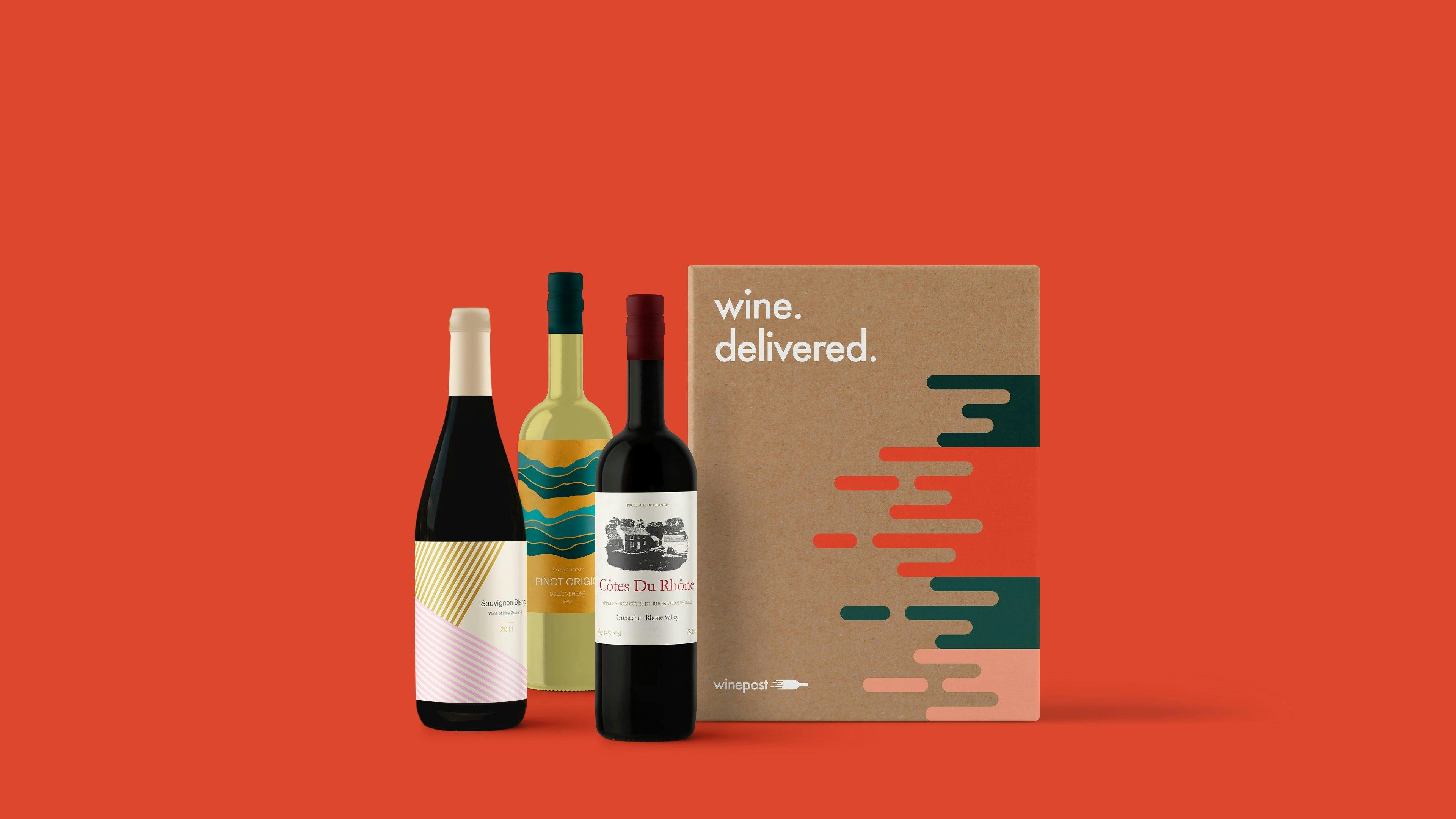 3 bottles of wine next to box with red background