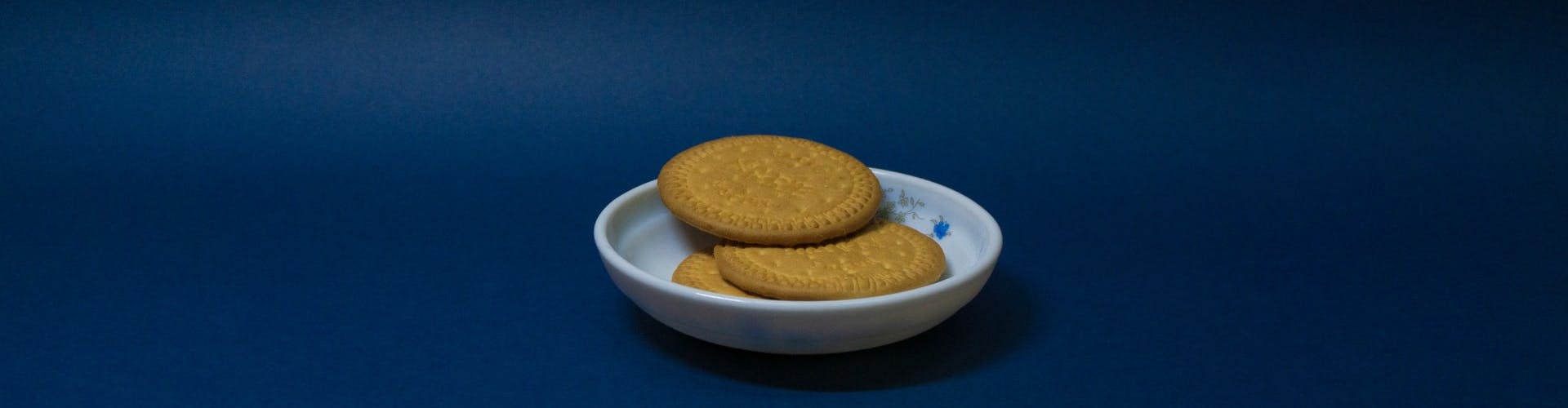 biscuits on a plate in front of a blue background 