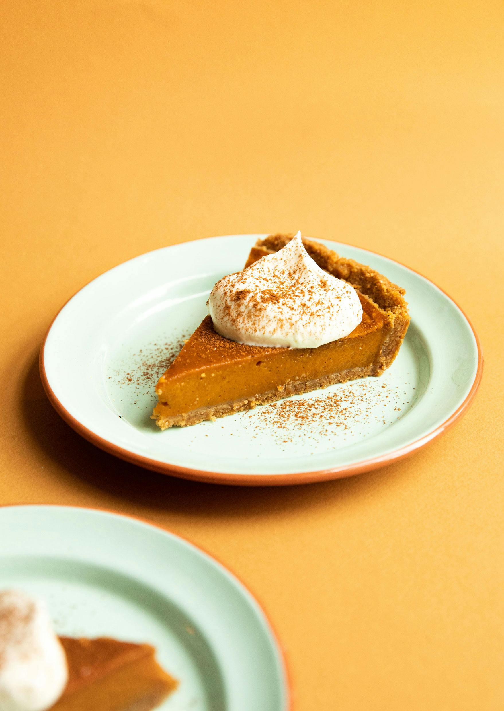 pumpkin pie slice with cream