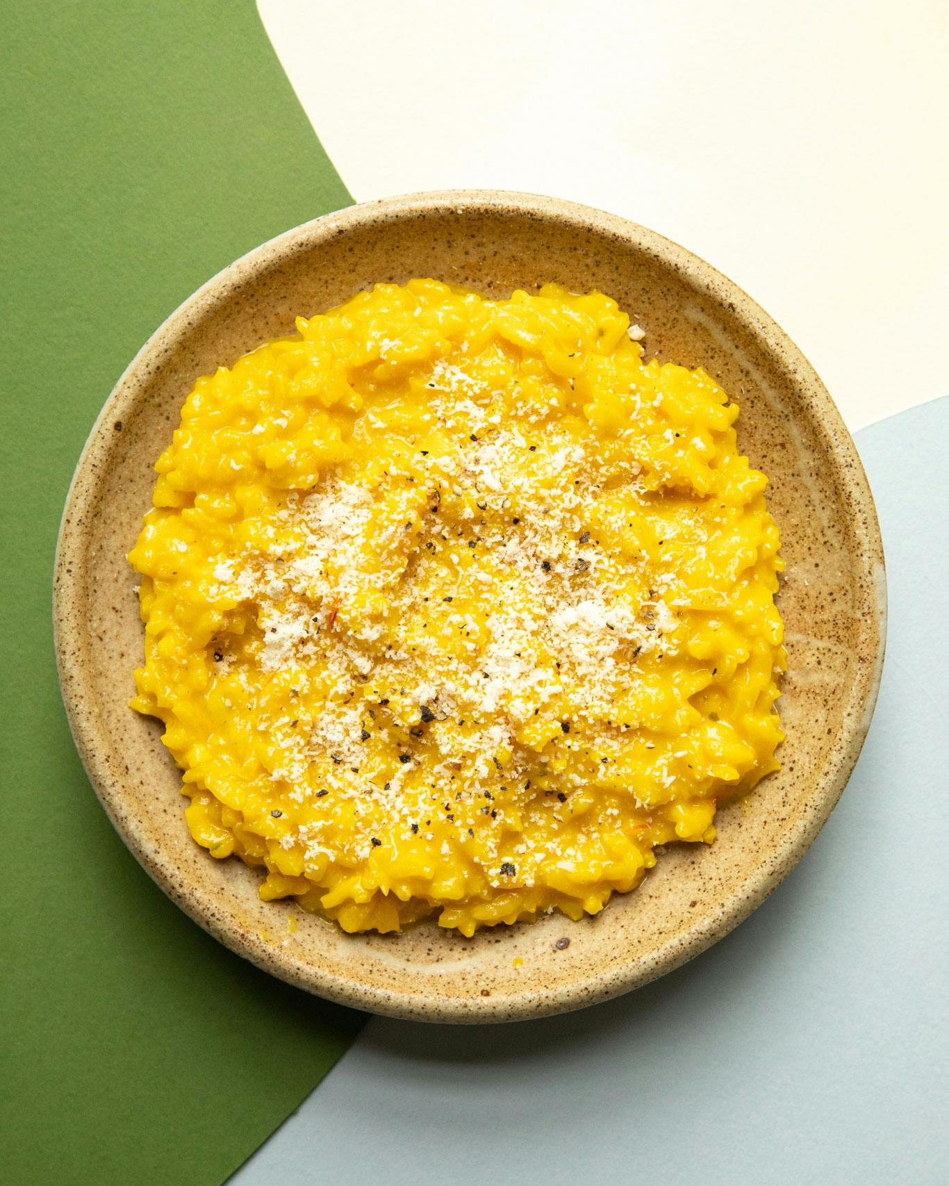 risotto in bowl on patterned background