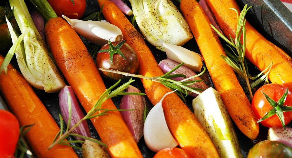 Chopped vegetables in a roasting tin