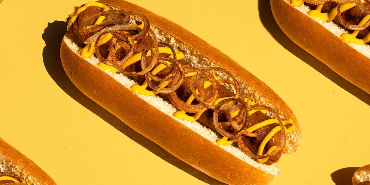 vegan hotdogs on yellow background