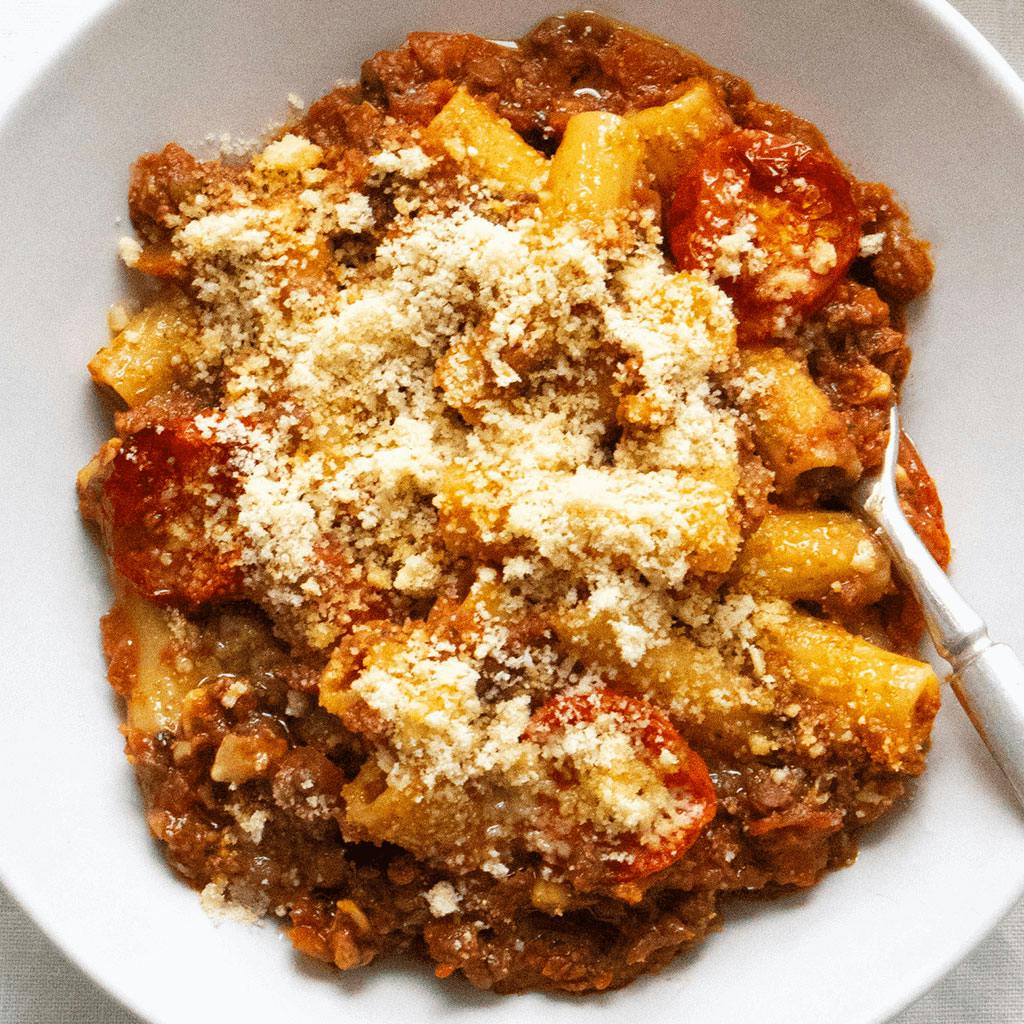 bolognese in white bowl with fork