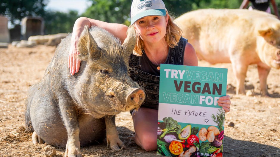 veganuary campaigner with pigs