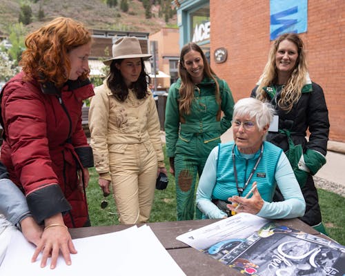 Sheri signing photos and telling stories of the old "Designs by Sheri" days.