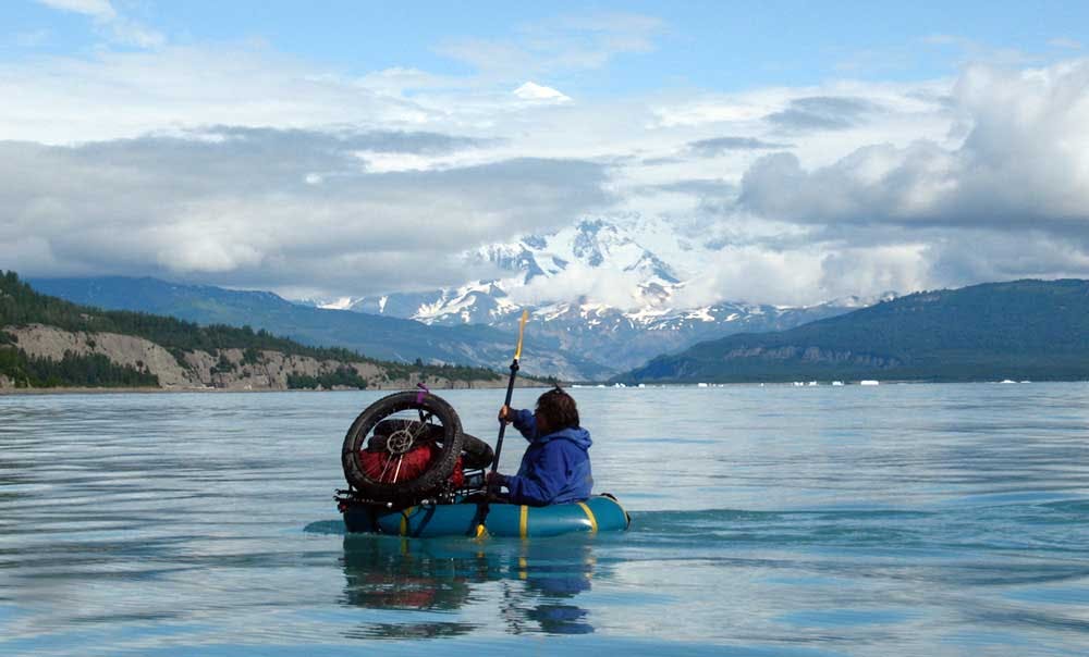 Dylan Kentch, paddling across Icy Bay (Mt. St Elias in the back) August 2008, courtesy of Sheri Tingey.