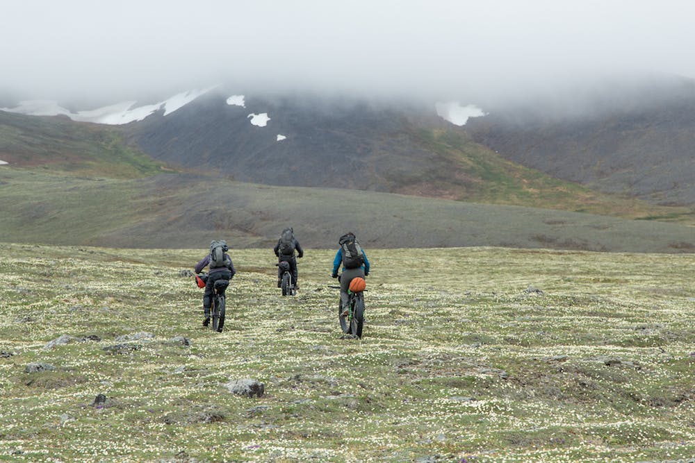 Kim McNett, Daniel Countiss, and Alayne Tetor ride over the firm tundra of the Lisburne Hills, the westernmost extent of the Brooks Range.&#xA0;