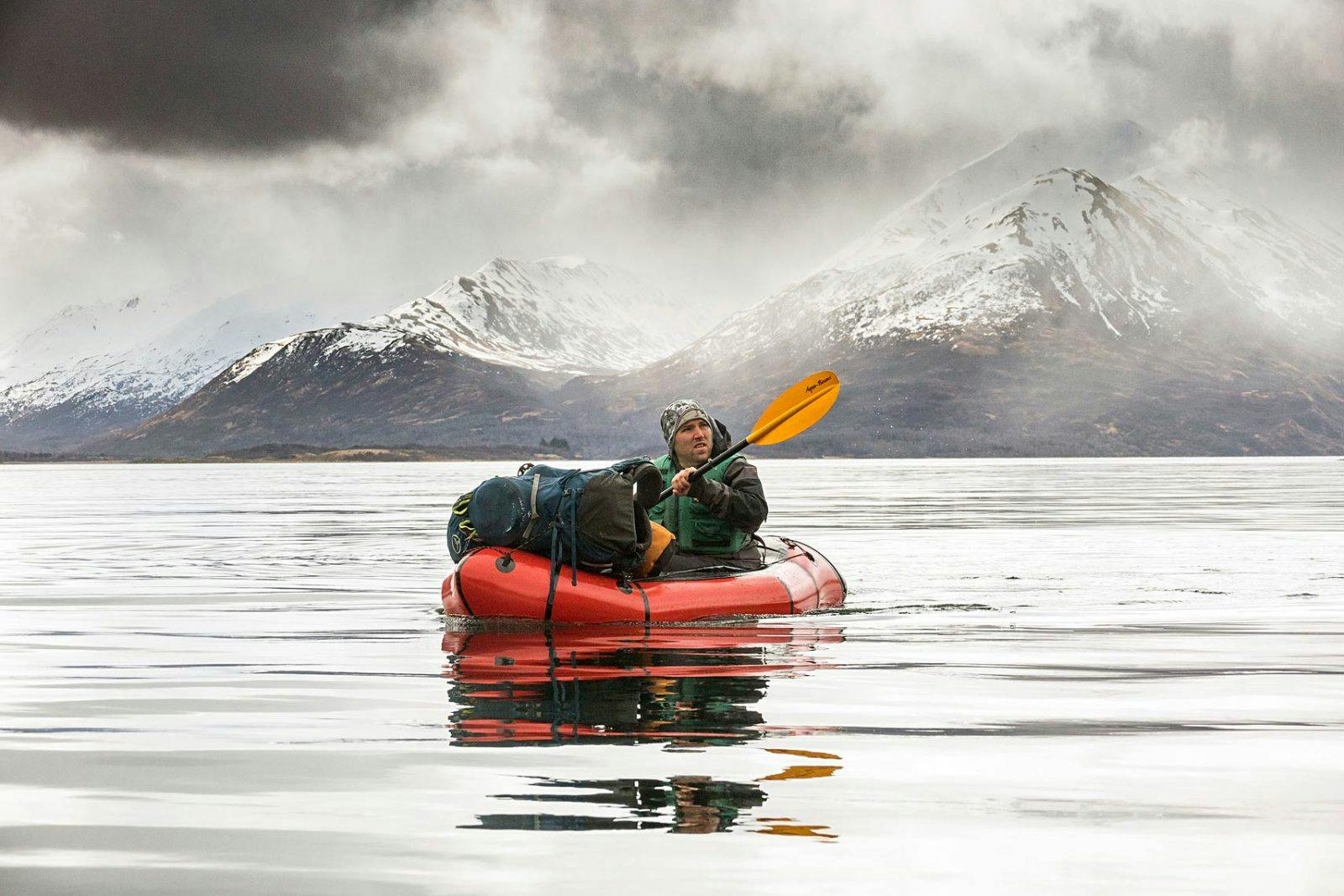 Bjorn Dihle packrafts on Karluk Lake on the final push to the starting point of the trip in Larsen Bay. Karluk Lake is home to the highest density of Kodiak brown bears on Kodiak Island.