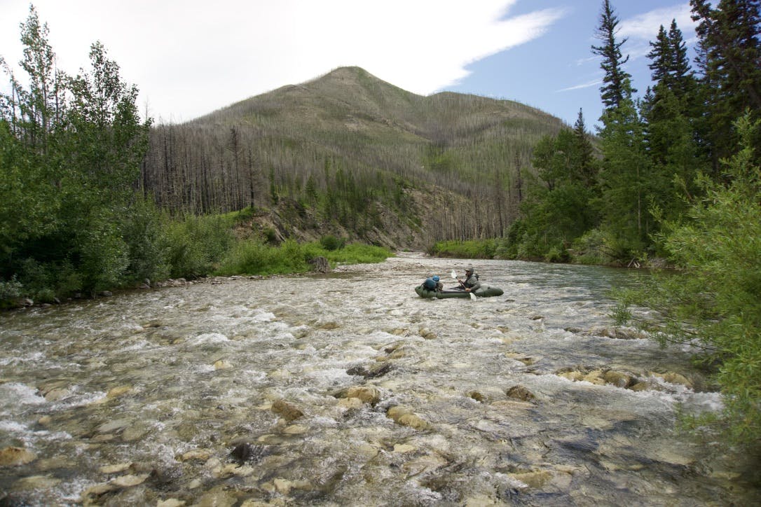 Scratching through the thinness of the river in our packrafts.