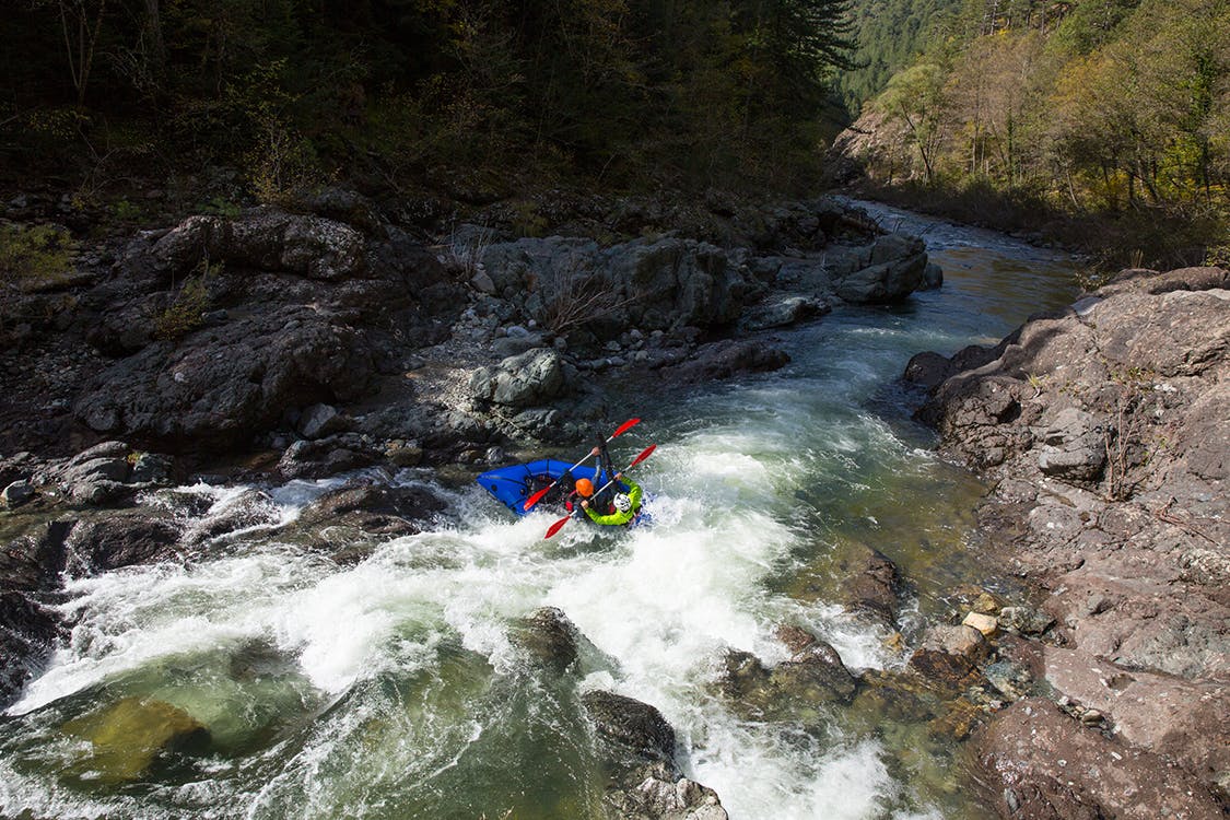 The Belgiums hitting a vigorous eddy line (and then shortly thereafter bailing), Aoos River, Northern Pindos National Park, Greece. Photo by Andrew Burr