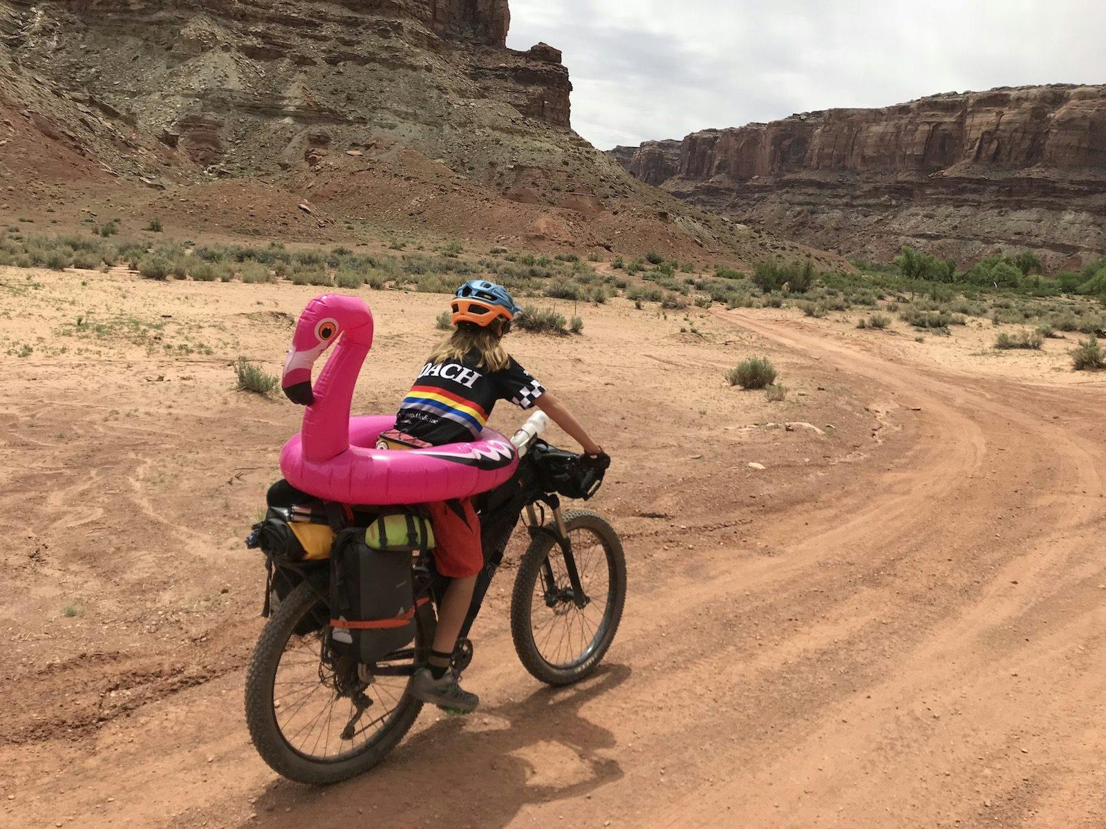 Shaw Kassay and Jerry the adventure buddy lead the group down Spring Canyon Road to the put-in.