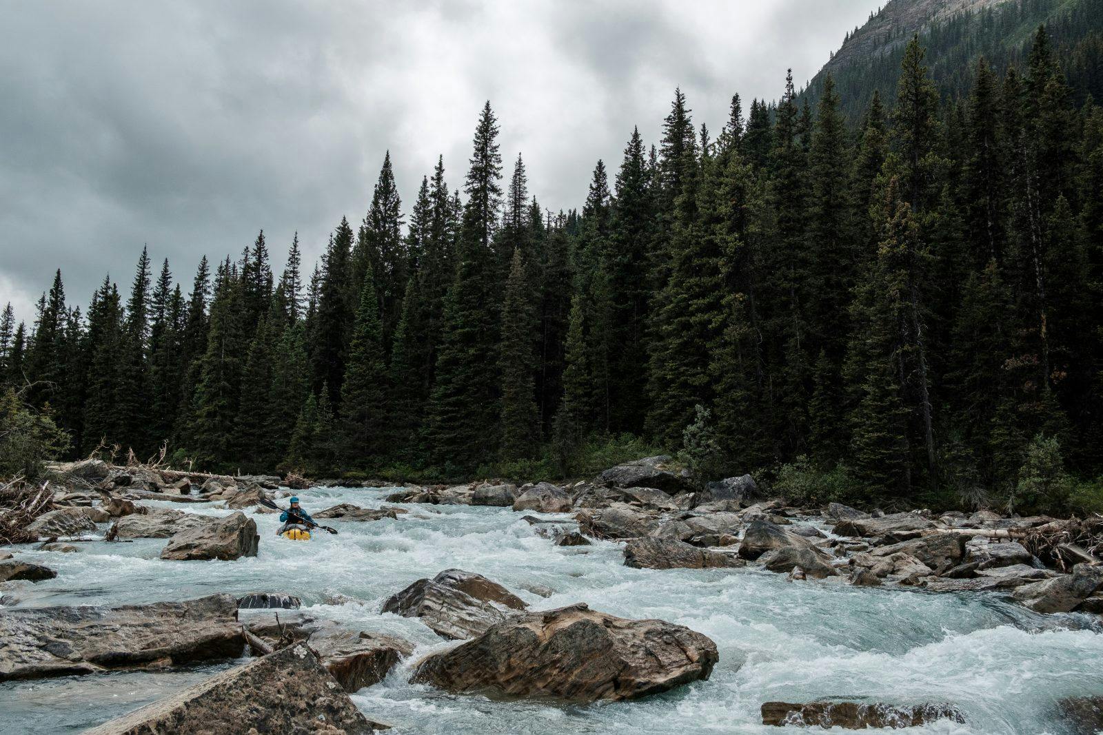 Rachel paddling through quick flowing rock garden rollercoasters. Photo by Coburn Brown