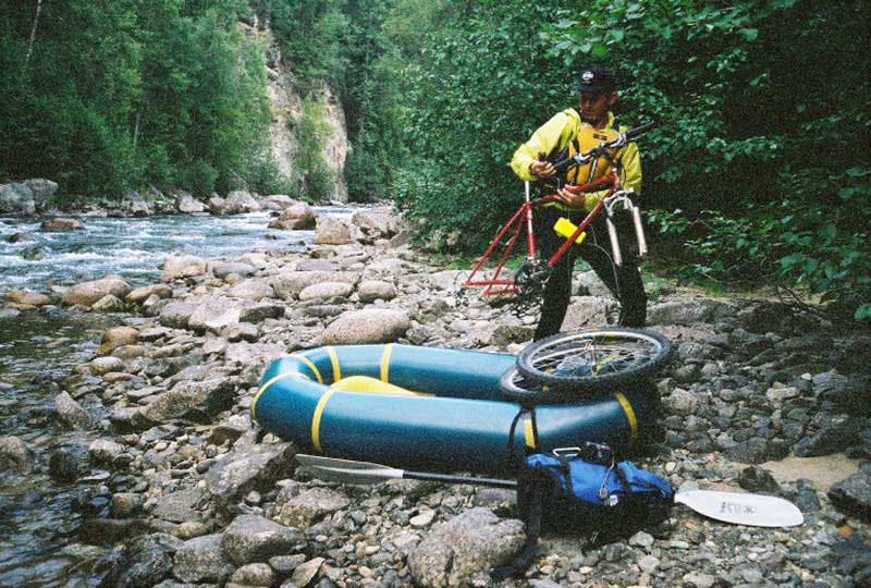 The first time Alpacka Raft tested a bike on a boat, 2003. Photo by Sheri Tingey.