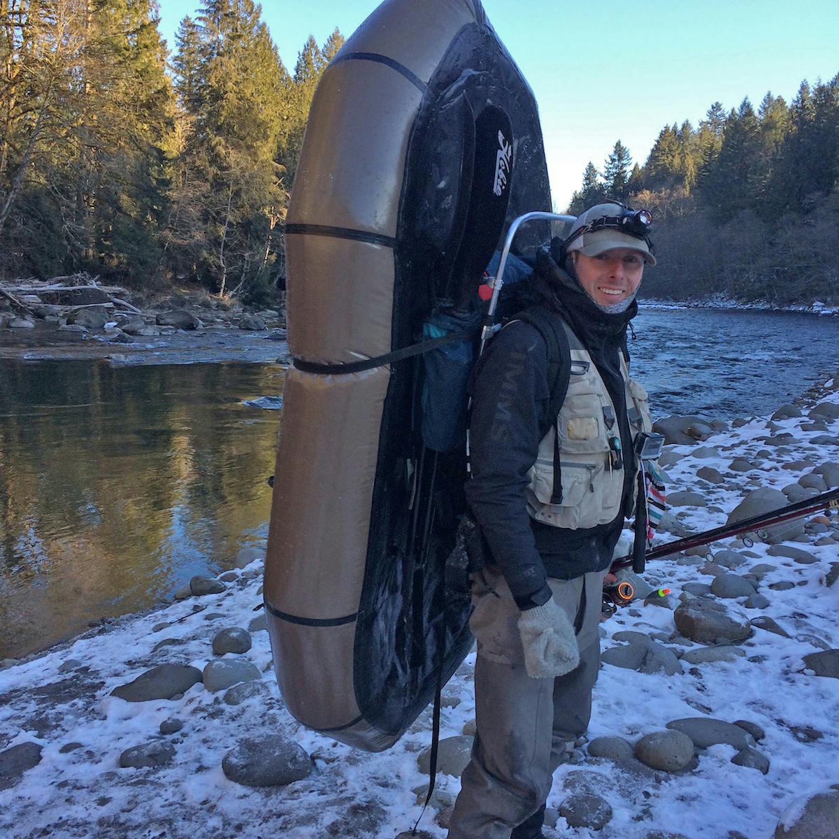 Packing around rapids is always safer than running them; especially in the winter. I use my Alpacka to run soft sections of the river but avoid technical water. It&#x2019;s easy to deflate the boat for longer walks, but this photo is a common occurrence whenever there&#x2019;s enough bank space. Trust me, its colder than it looks.