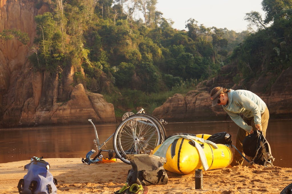 With everything in the boat, the only left to do is strap the bike to the boat. No matter how many times I put a bike on a packraft I end up smiling and laughing untill it hurts. It&#x2019;s a crazy idea that has changed how I look at the world. With they right bike and boat anything is possible.&#xA0;Even at 5a.m. villagers would walk out of the forest to see who we were and what we were up to.