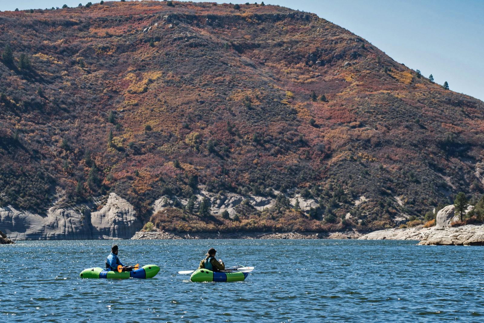 Photo of CEO Thor Tingey and customer service rep Molly Harrison on McPhee Reservoir by Steve Fassbinder.