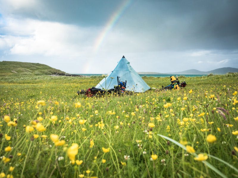 &#x201C;Our first night on north Uist was a change for the better, when the rain finally let some sun through. In June and July the unique ecosystem of dune meadows called the Machair comes into flower, and we slept on a carpet of wildflowers with just bumblebees and a very friendly dog (that we called Jerry) for company. He followed us for miles from the last farm we passed. The Outer Hebrides stand out for me for the sheer number of peaceful, beautiful and unexpected camp spots&#x201D;&#x9D; Photo: Huw oliver