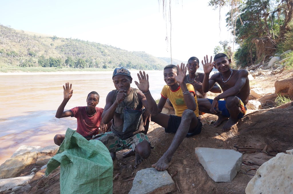 Seeking food and shade we pulled over to stop for a lunch break. 15 minutes into our lunch we noticed two dugout canoes 10 meters downstream, at about the same time these five men walked out of the forest. Both parties were equally as starled to see the other, we had the perfect way to bridge the communcation gap, a bottle of whiskey. We offered each member a cap full, smiled, and high-fived each other.