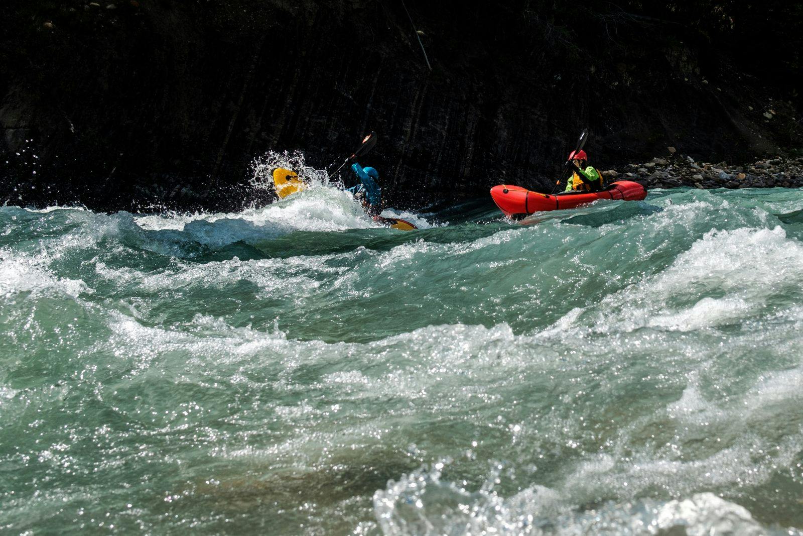 Rachel Davies and Laura Robinson smashing wave trains on the Snake Indian River. Photo by Coburn Brown