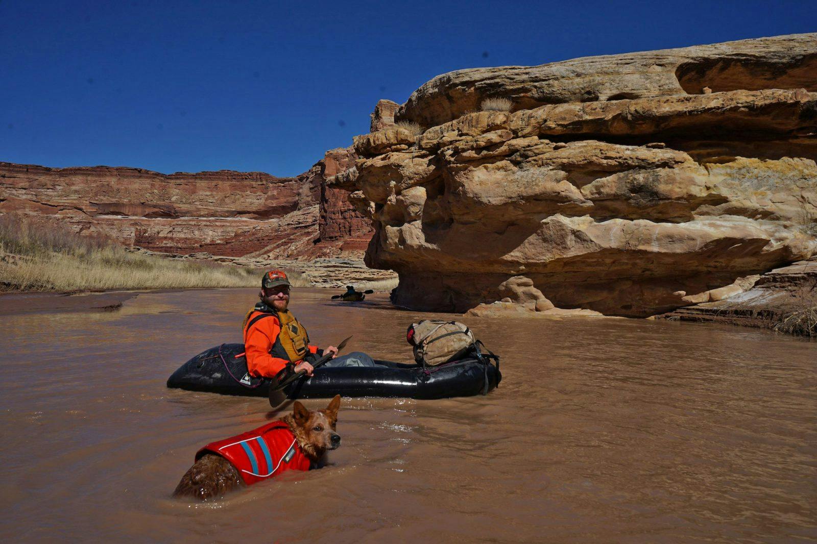 Photo of Tyler Marlow and Sprocket swimming by Molly Harrison.