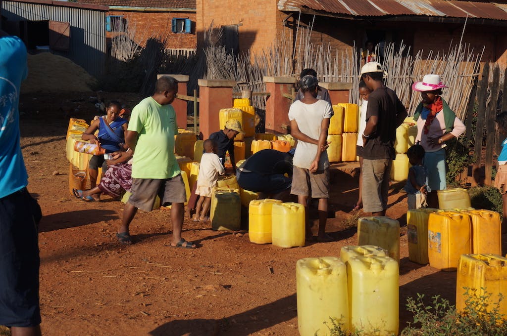 Every morning villagers gather around the town spigot in order to get water. Families can water for hours to get water and serves a spot to catch up with each other over coffee and food.