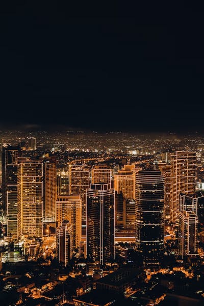 Image of a city at night - bring yellow lights