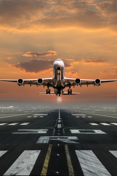 Plane taking off Sunrise