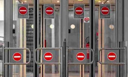 airport security with 'do not enter' signs
