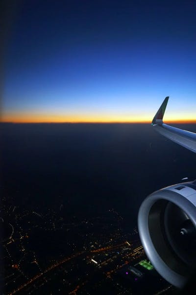 Image of plane wing at sunset
