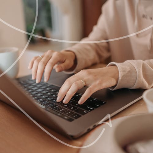Woman typing on a laptop