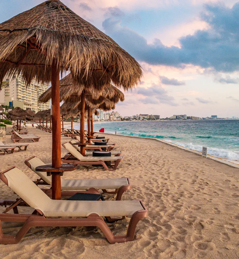 Deck chairs and umbrellas on a beach in Cancun