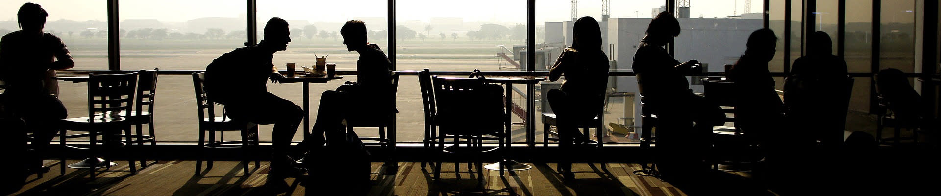 Picture of people sitting in a cafe at the airport